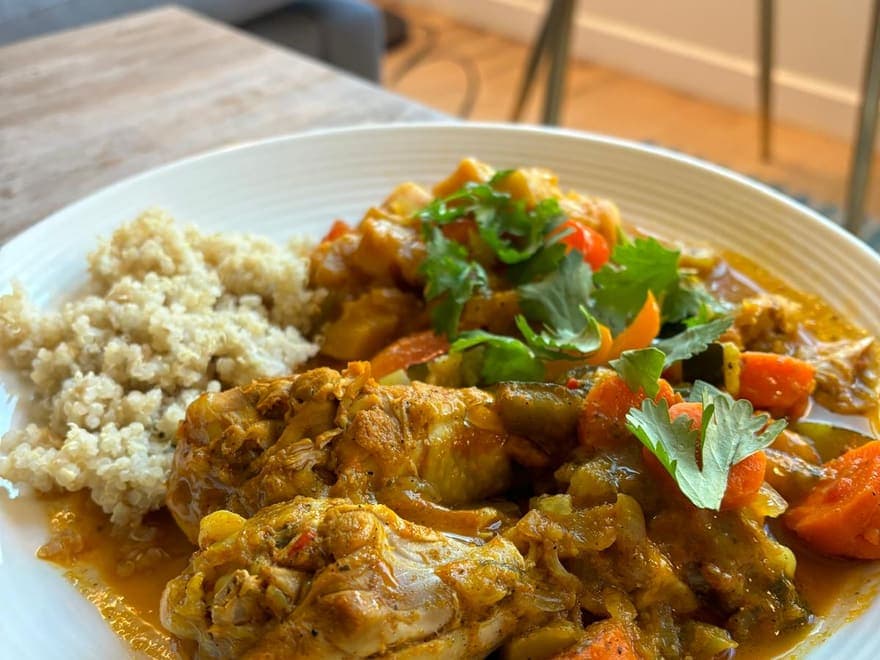 A Caribbean chicken stew with carrots and coriander, served with quinoa.